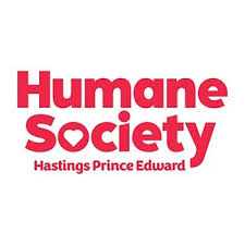 Humane Society Hastings Prince Edward logo in red text on a white background, with a heart shape forming the “o” in “Society.”.